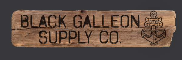 Wooden sign with the words 'Black Galleon Supply Co.' and an anchor and rope design in the upper right corner.