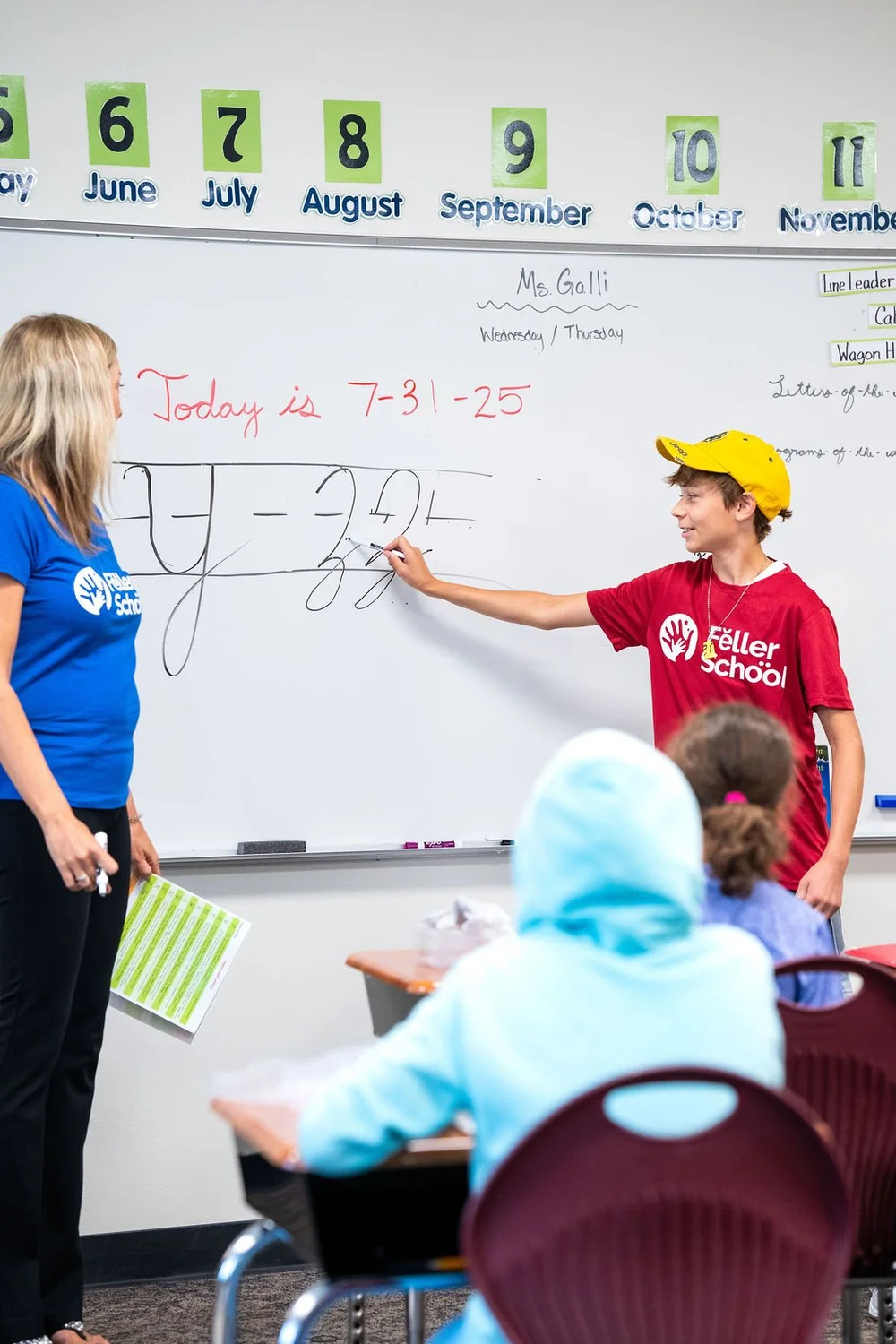 Teacher working with student