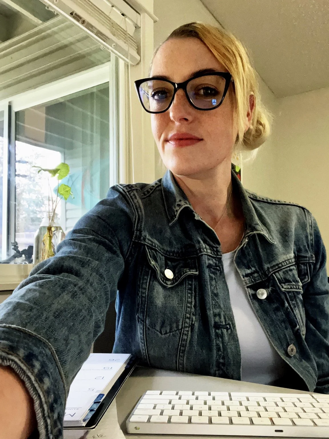 Founder of I Am His Karma working at her computer on the survivor archive.