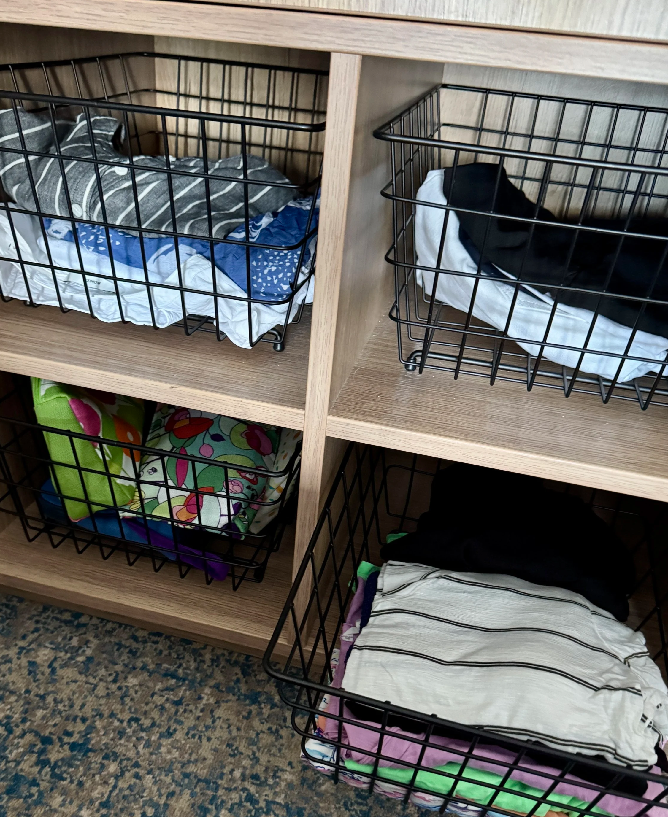 The closet had several wire baskets that were perfect for storing clothes, socks or general clutter