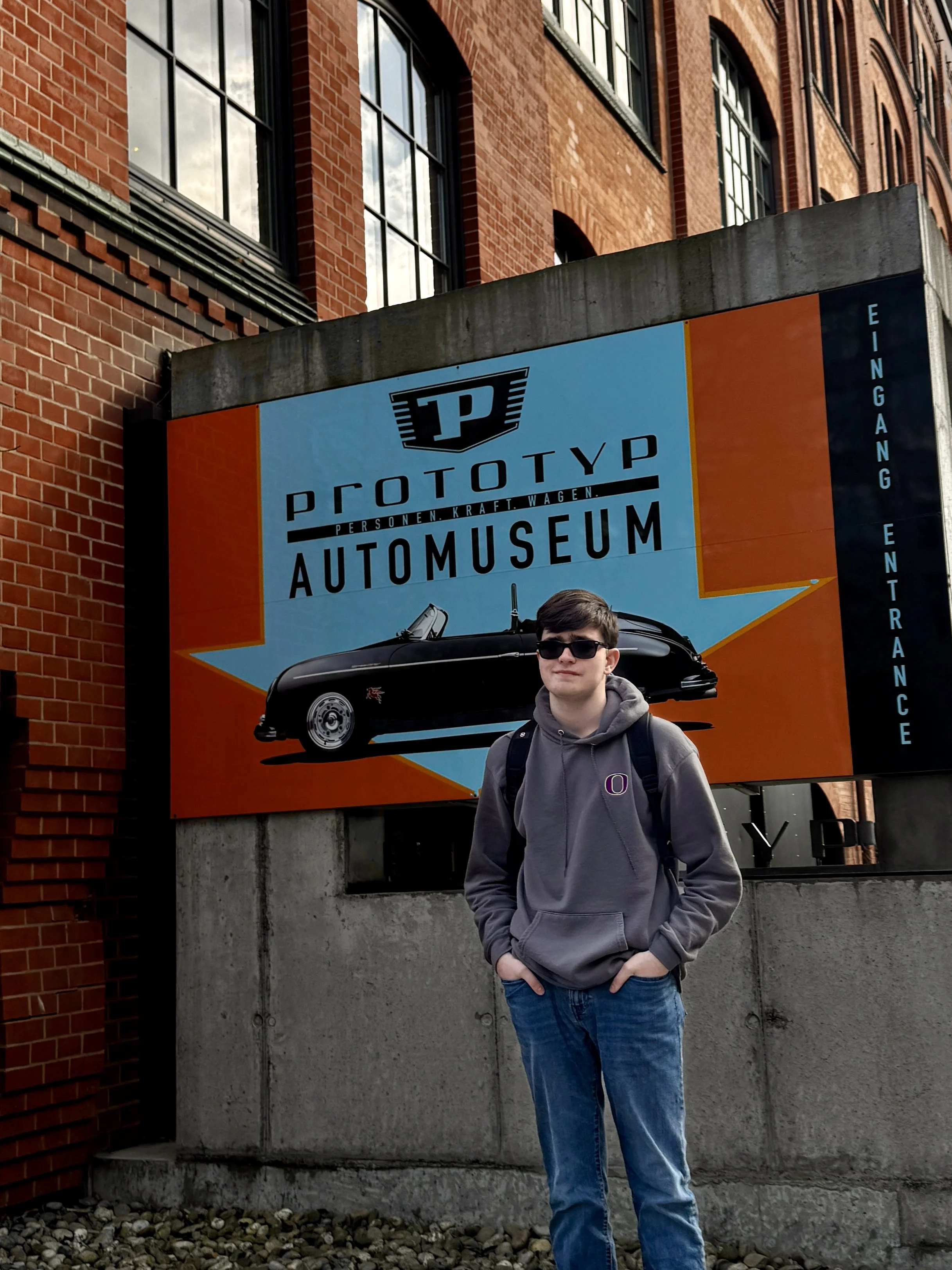 Teen standing outside Prototyp Automuseum in Hamburg, Germany