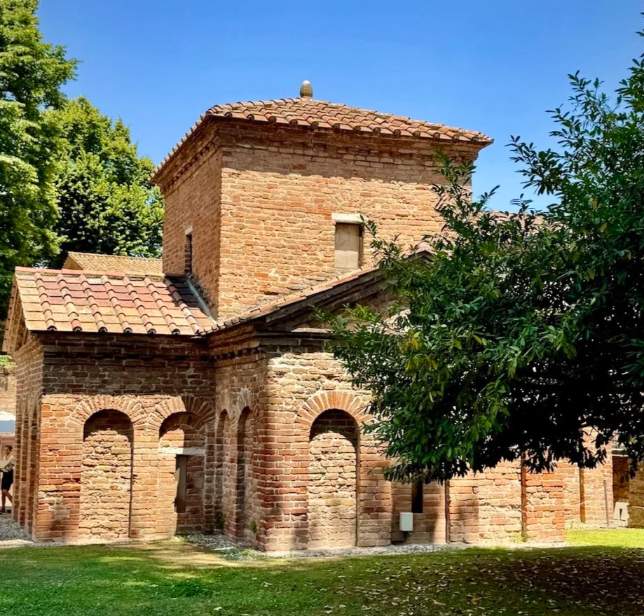Plain brick exterior of the Mausoleum of Galla Placidia in Ravenna, Italy