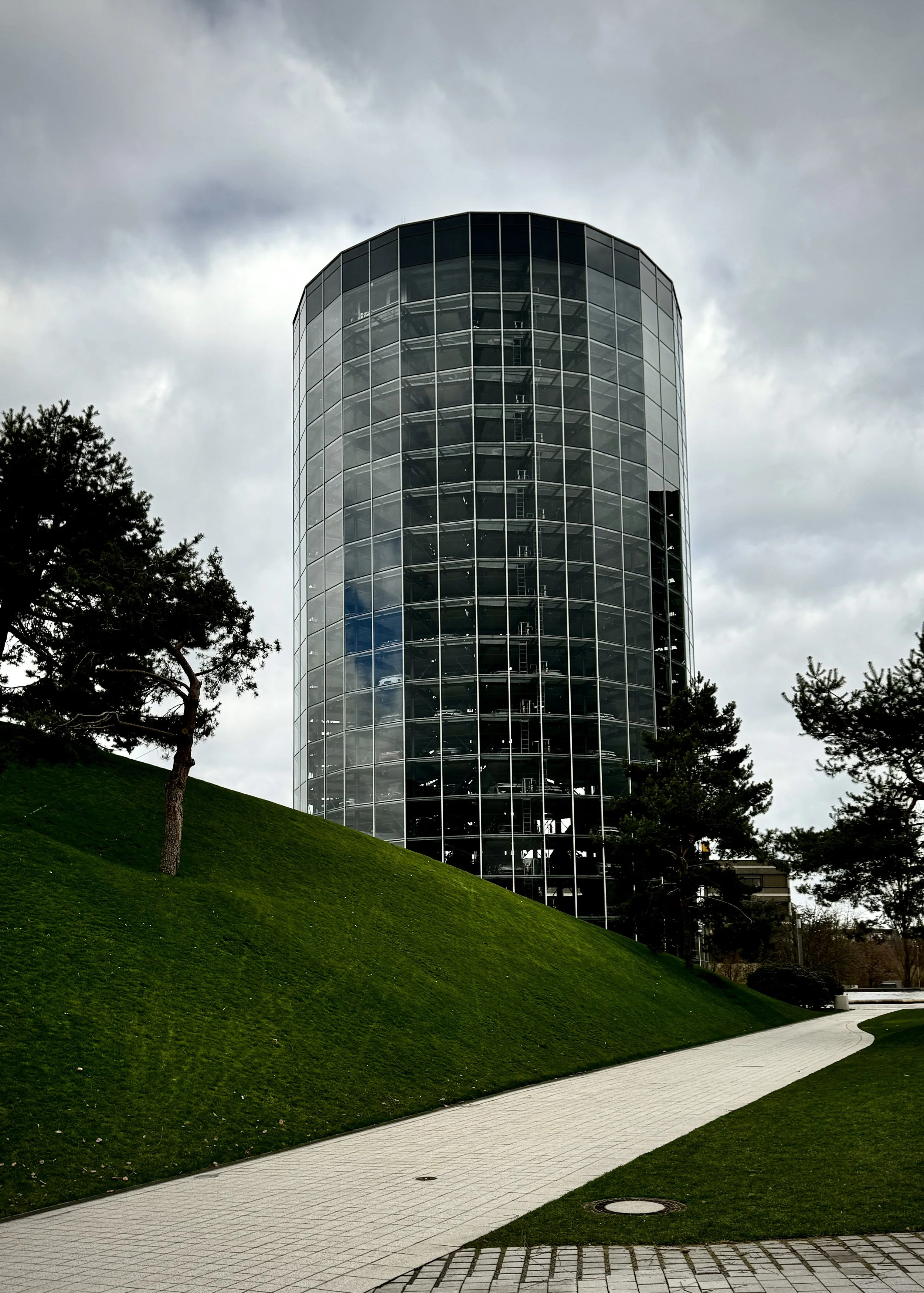 One of the iconic glass car towers at Autostadt in Wolfsburg, Germany, photographed during a mother-son road trip through Germany.
