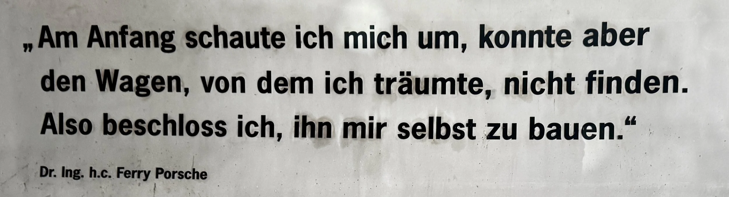 Photo of Ferry Porsche's quote about Porsche's origin at Autostadt in Wolfsburg.