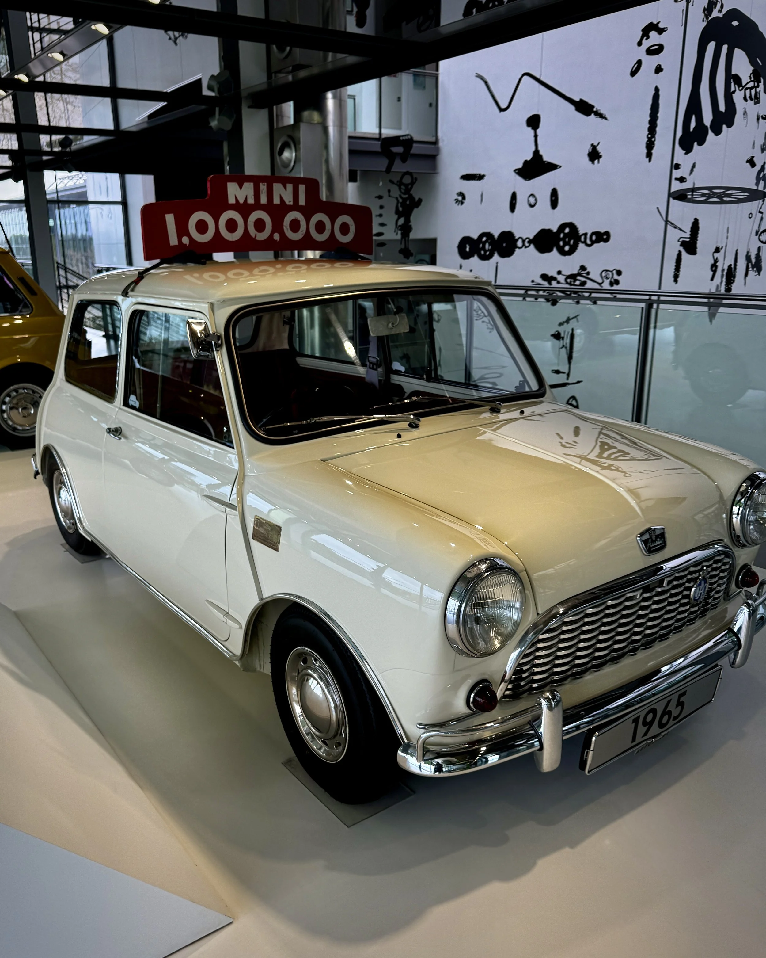 A classic Mini with a "MINI 1,000,000" sign displayed at the Zeithaus automotive museum in Wolfsburg, Germany.