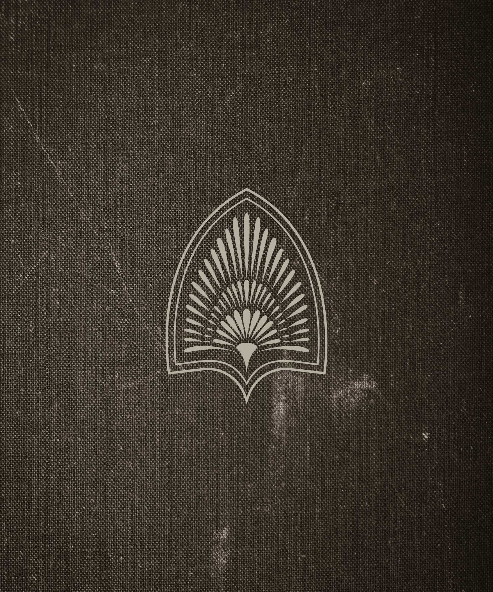Black textured background with a white ornate, geometric, floral design in the center