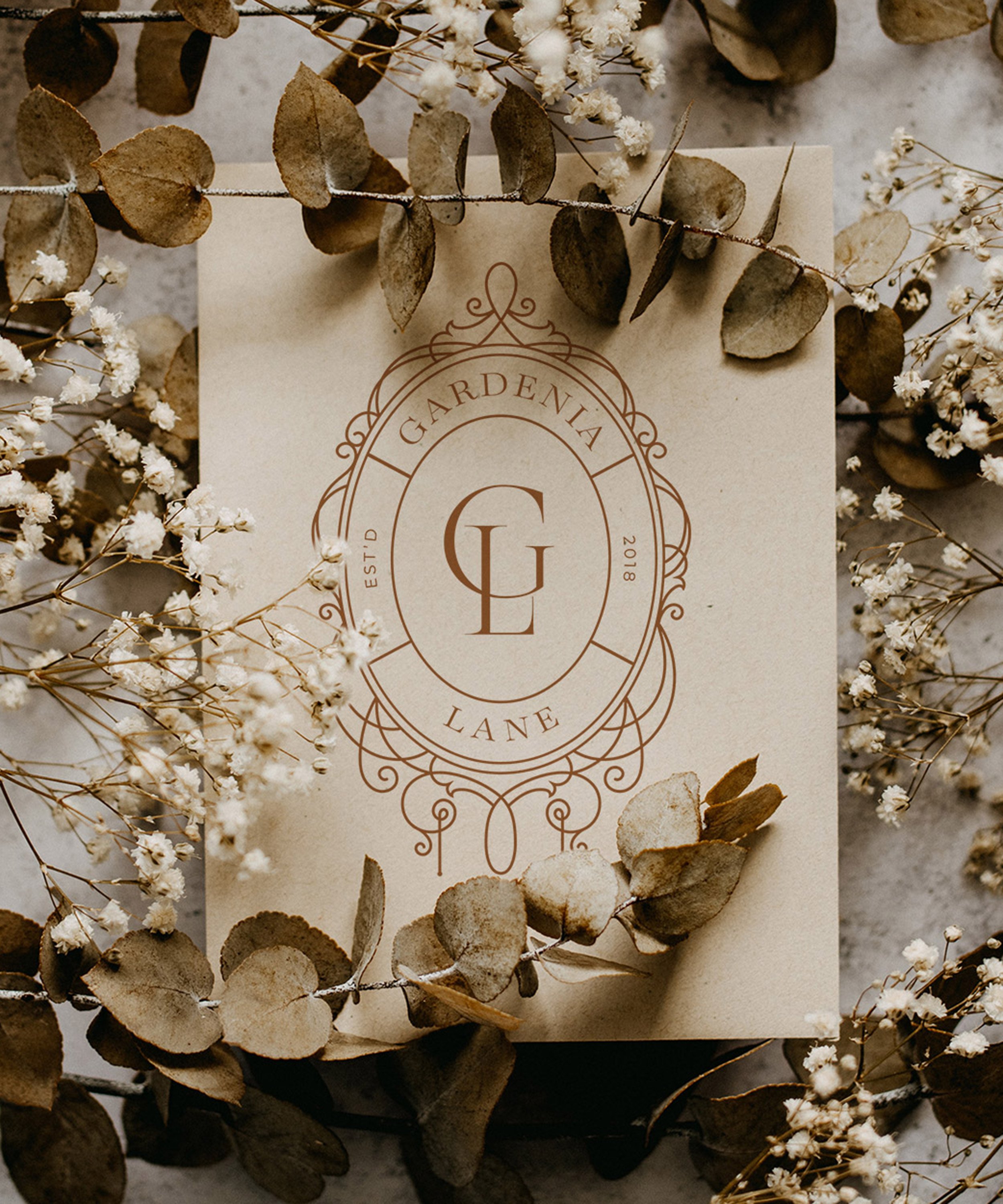 Floral logo design featuring an ornate frame for personal branding, photographers, designers
