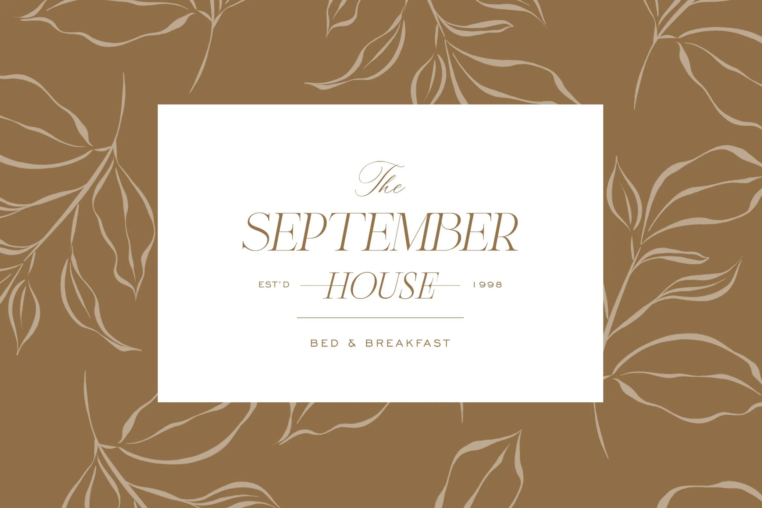 A logo for The September House bed and breakfast, established in 1998, with a white rectangular background and a brown leafy border.