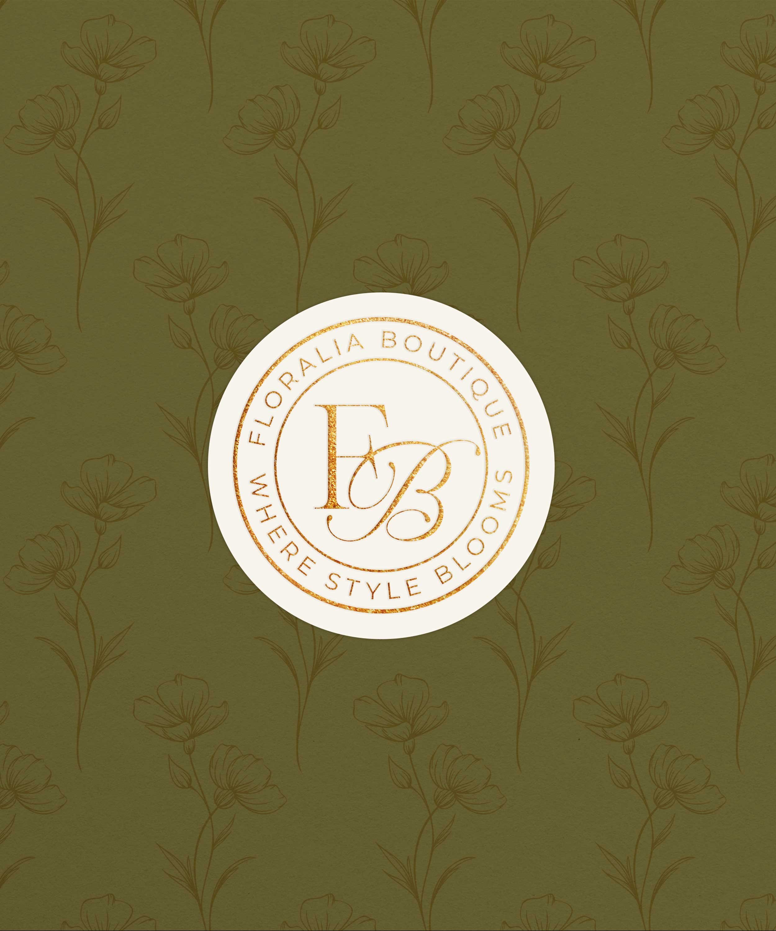 Green background with a floral pattern and a white circular logo in the center reading "Floralia Boutique" with the initials "FB" inside, and the phrase "Where Style Blooms" around the circle.