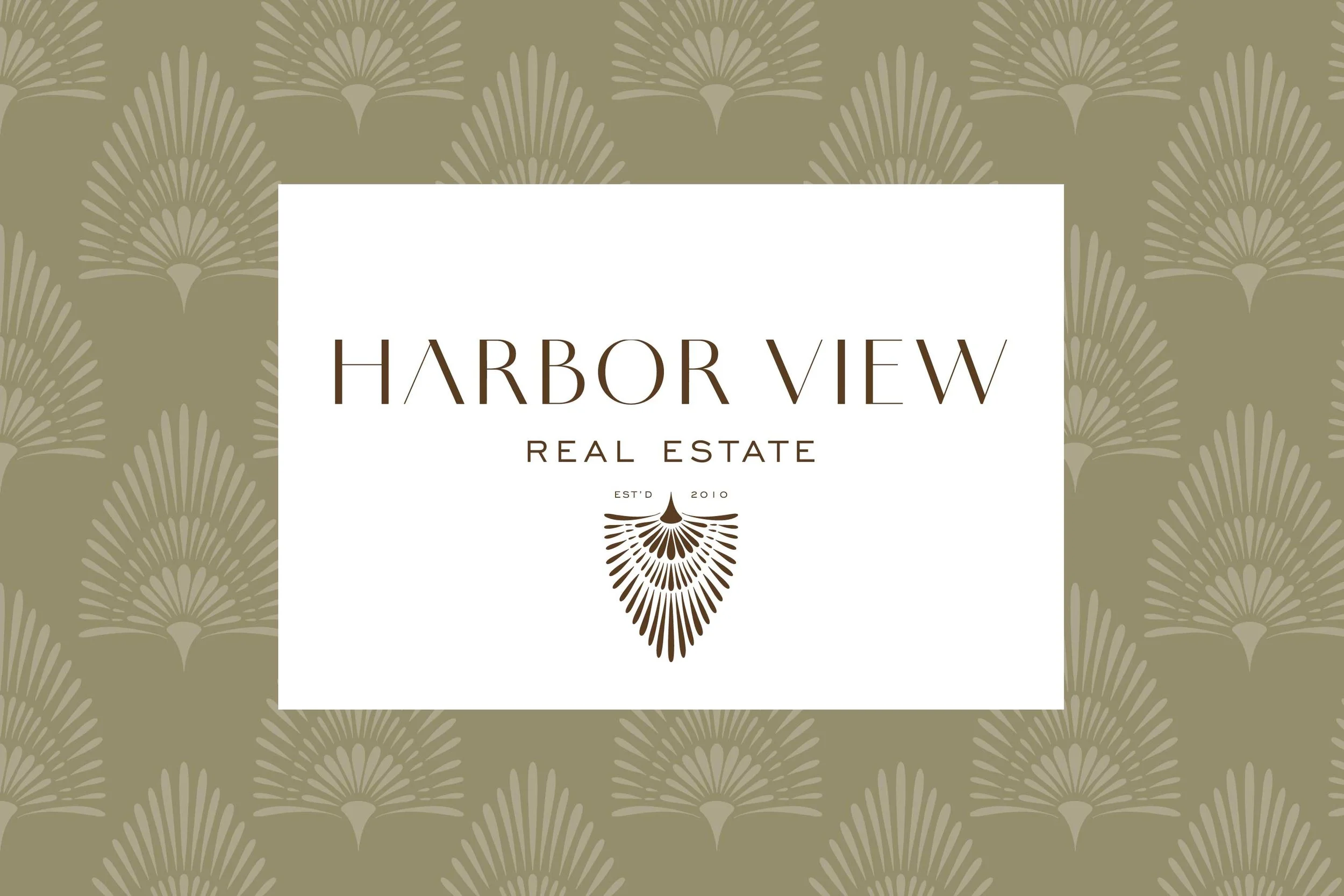 Logo for Harbor View Real Estate with a stylized leaf or seed pod design, on a beige patterned background.