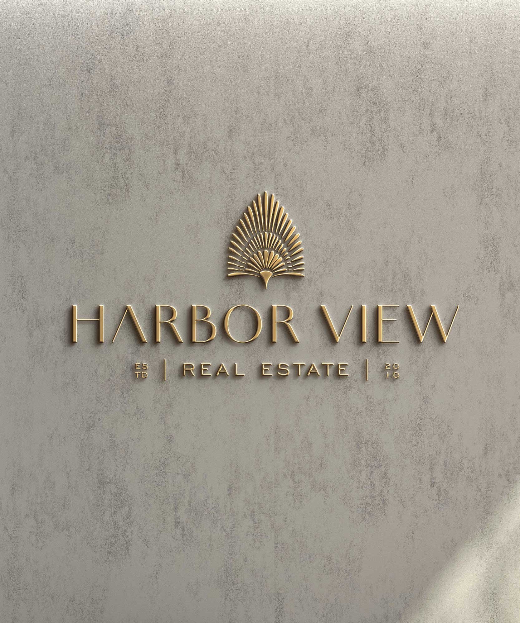 Gold 3D logo for Harbor View Real Estate, featuring a stylized palm tree icon on gray textured background.