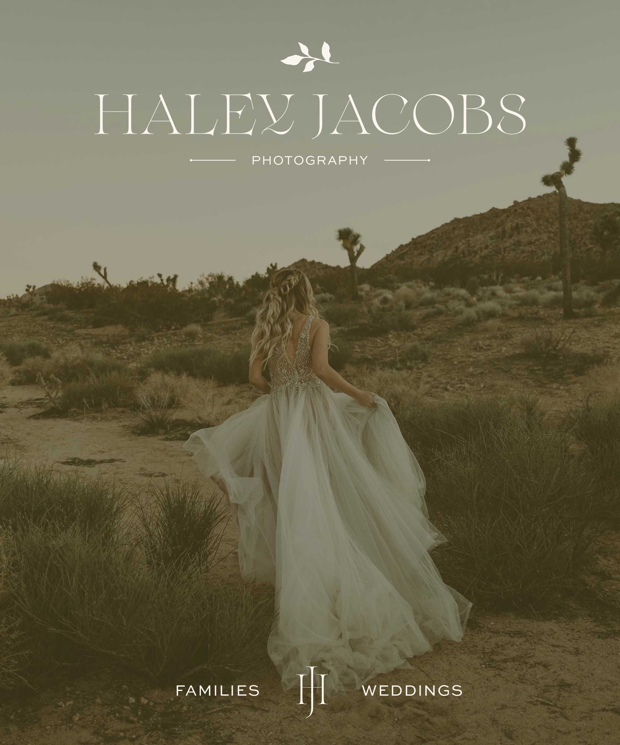 A woman in a flowing wedding dress walking through the desert landscape with mountains and Joshua trees in the background.