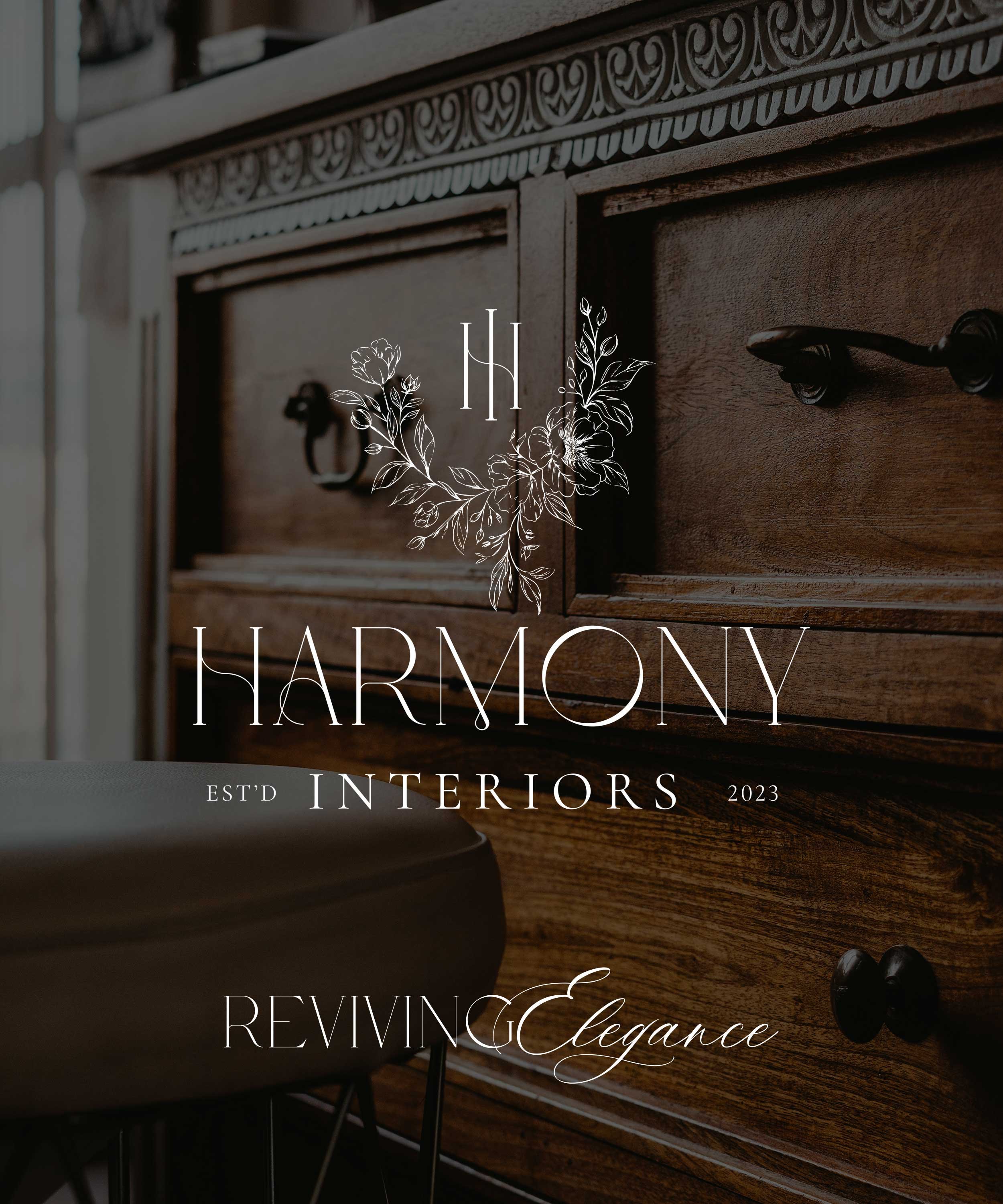 Close-up view of a vintage wooden dresser with decorative carvings and black handles, with overlaid text promoting Harmony Interiors for 2023.