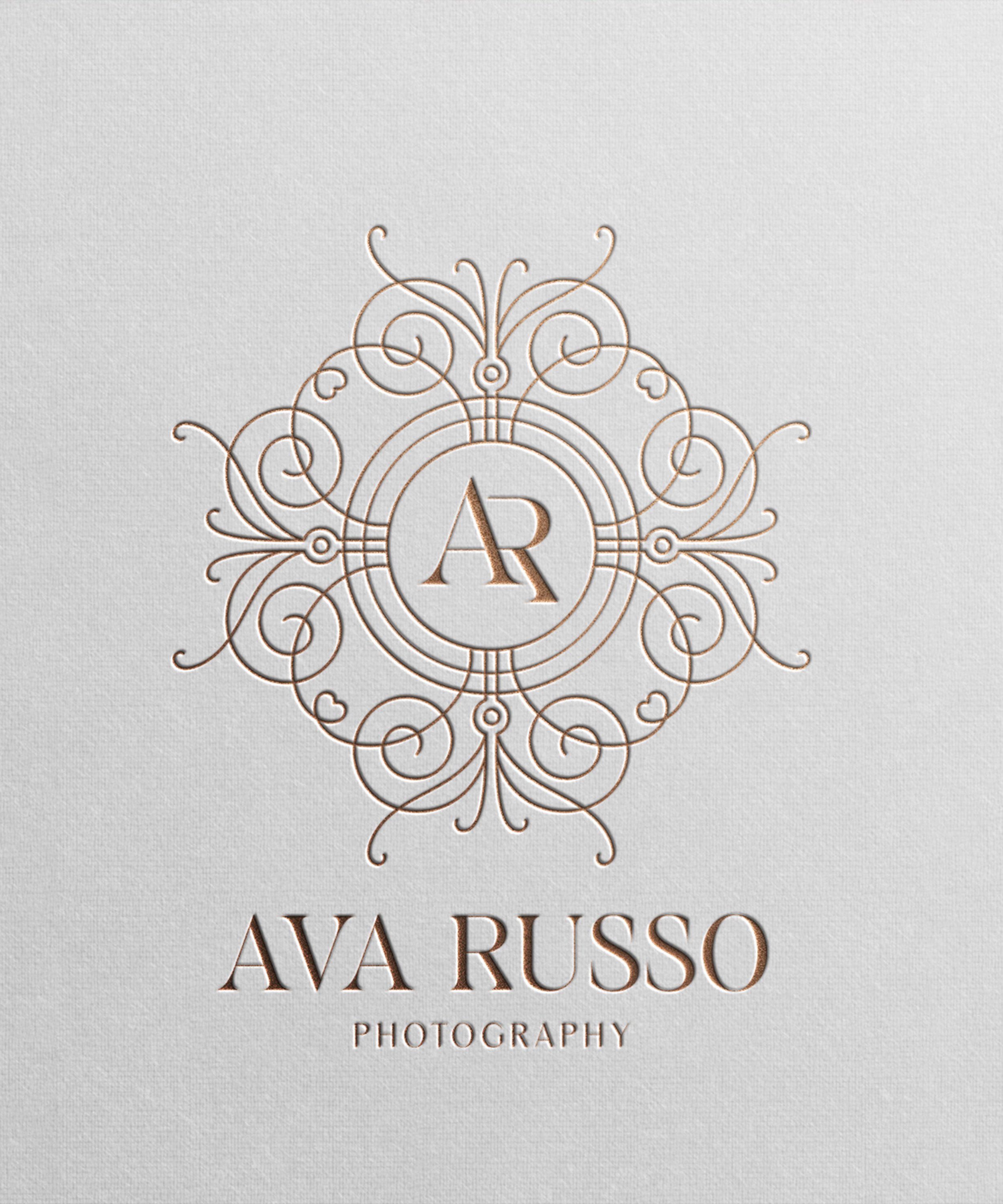 Elegant logo for Ava Russo Photography featuring a detailed, ornate circular design with the initials 'AR' in the center and the text 'AVA RUSSO PHOTOGRAPHY' below.