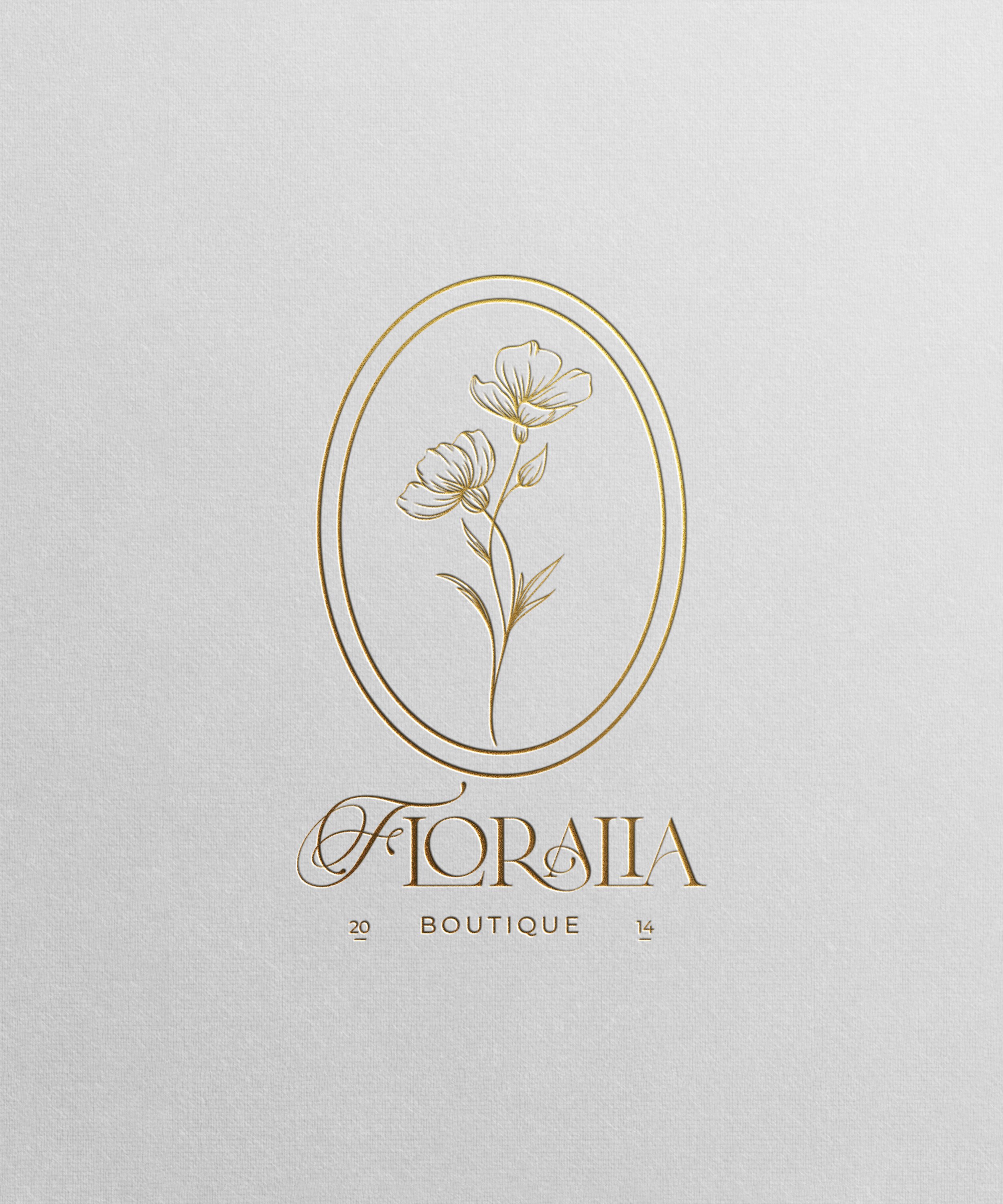 Logo for Floralia Boutique featuring a gold outline of two flowers inside an oval