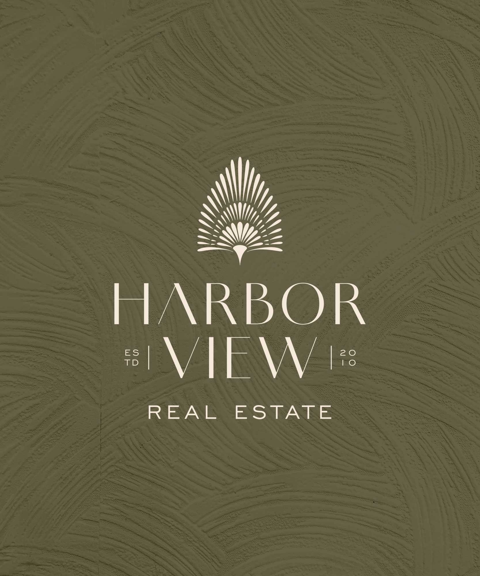 Logo for Harbor View Real Estate with a stylized palm tree design and text indicating establishment in 2010.