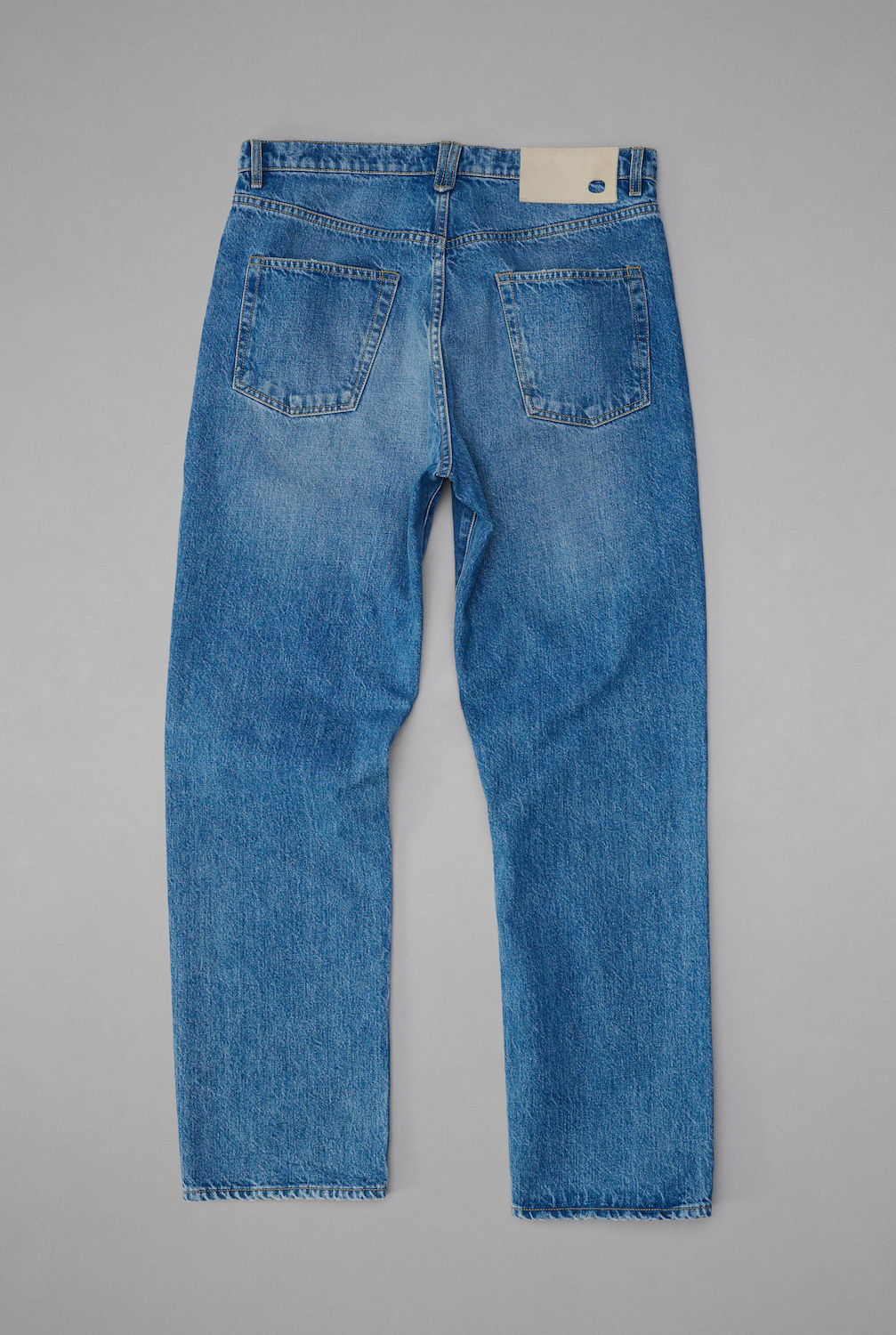 Taper Jean Mid Blue Back.png