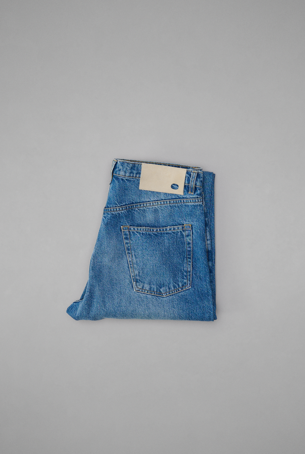 Taper Jean Mid Blue Folded.png