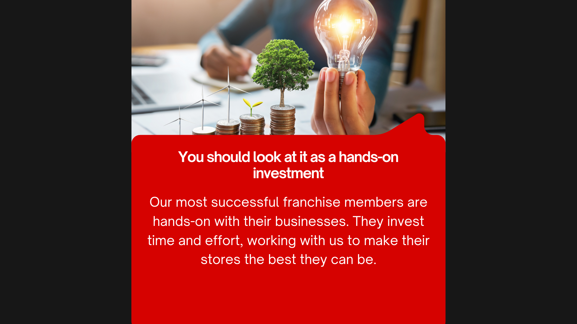 A hand holding a light bulb with a glowing filament, standing above stacked coins with miniature wind turbines and a small tree growing on top. Background shows a person writing at a desk. Overlaid red banner with white text about hands-on investment and franchise success.
