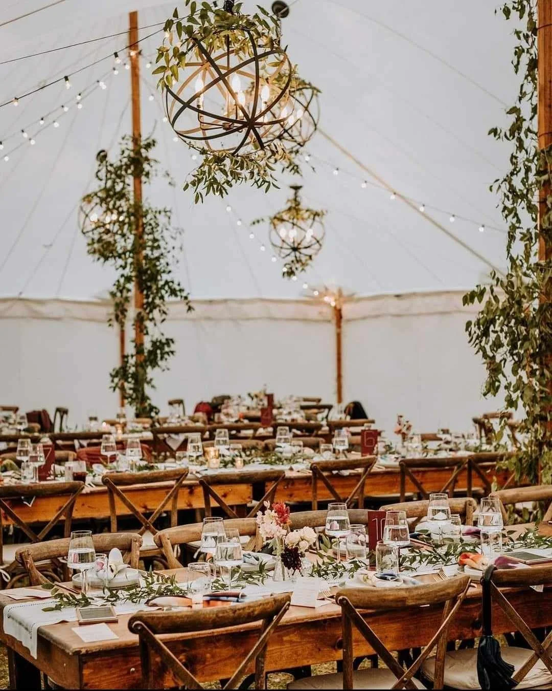 Orb Chandeliers with greenery - tent (1).jpg