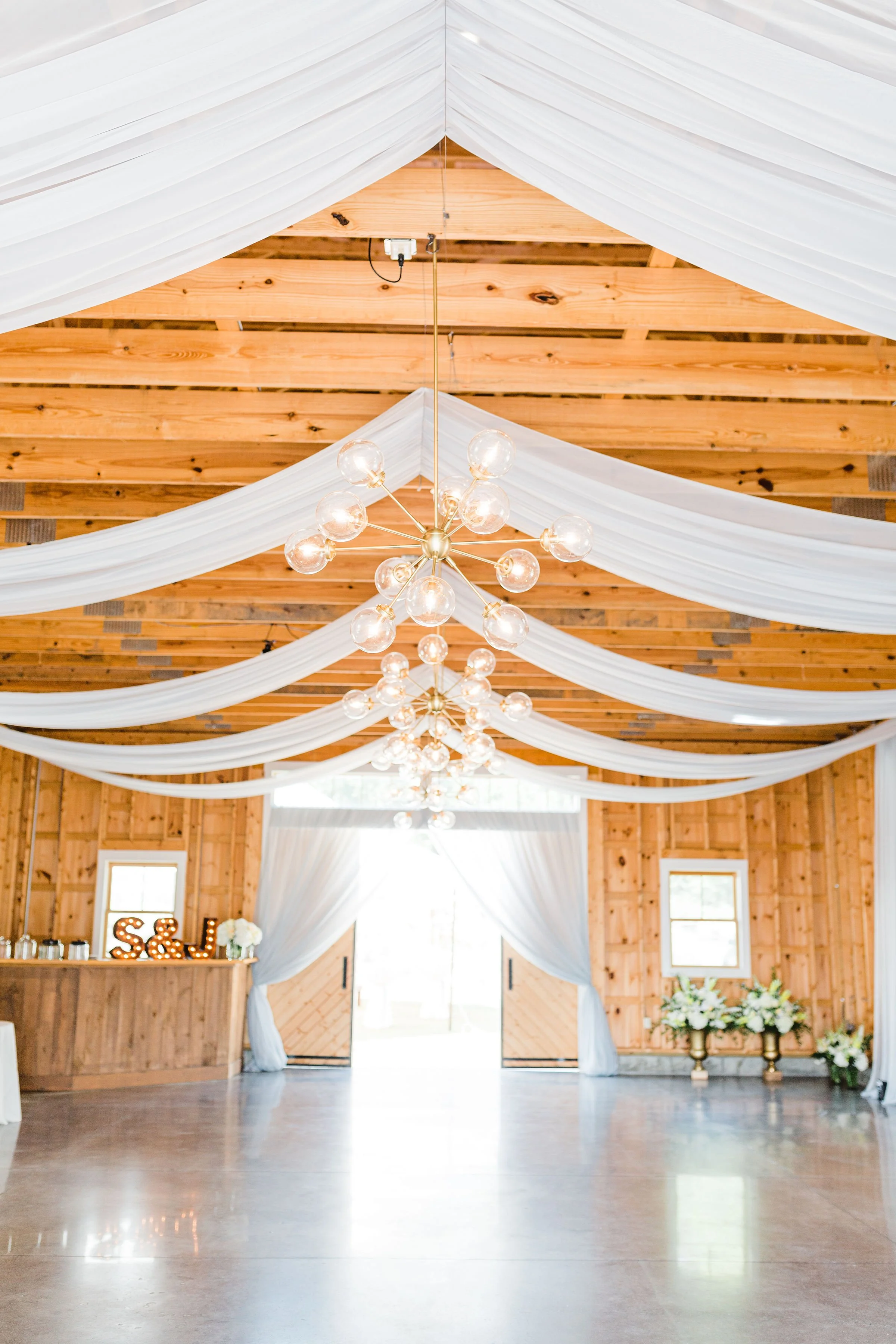 Autumn Lane - Flat silver draping with Sputnik chandeliers.jpg