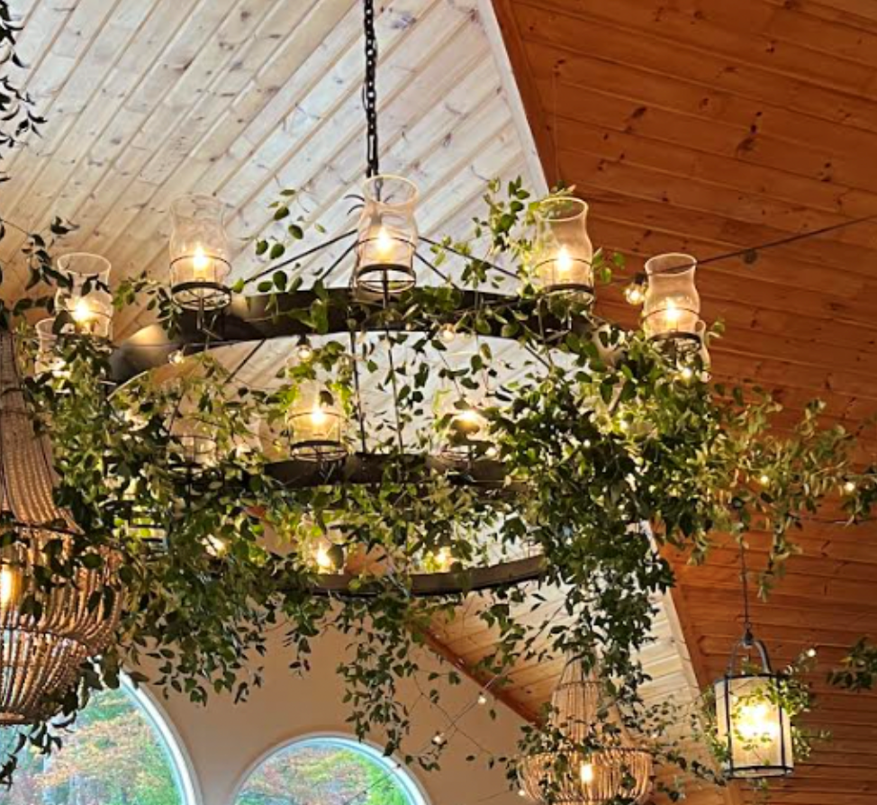 Spruce Point Inn Chandelier with Greenery.png