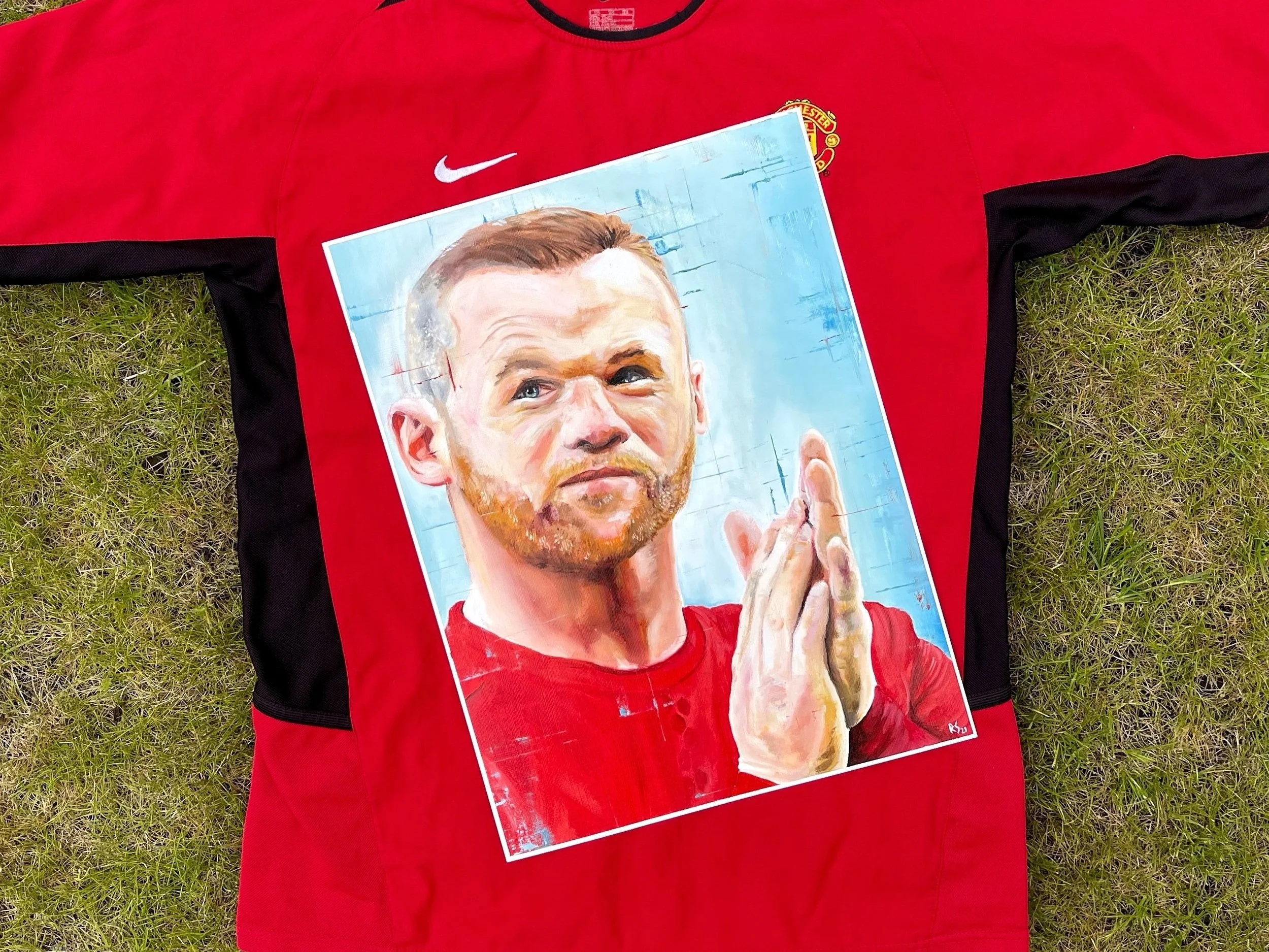 painting of footballer clapping
