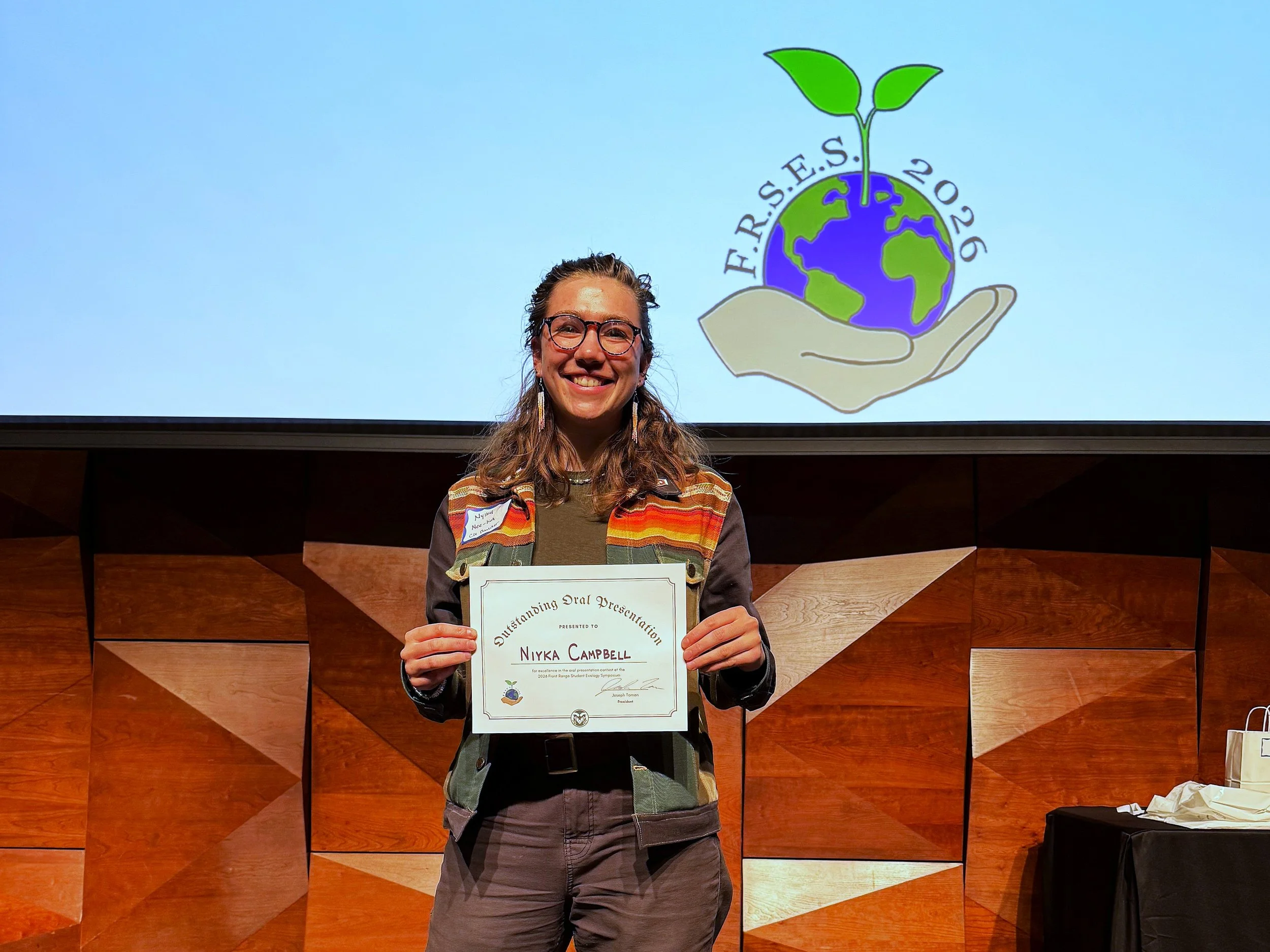 Nyika Campbell is recognized at the Front Range Student Ecology Symposium