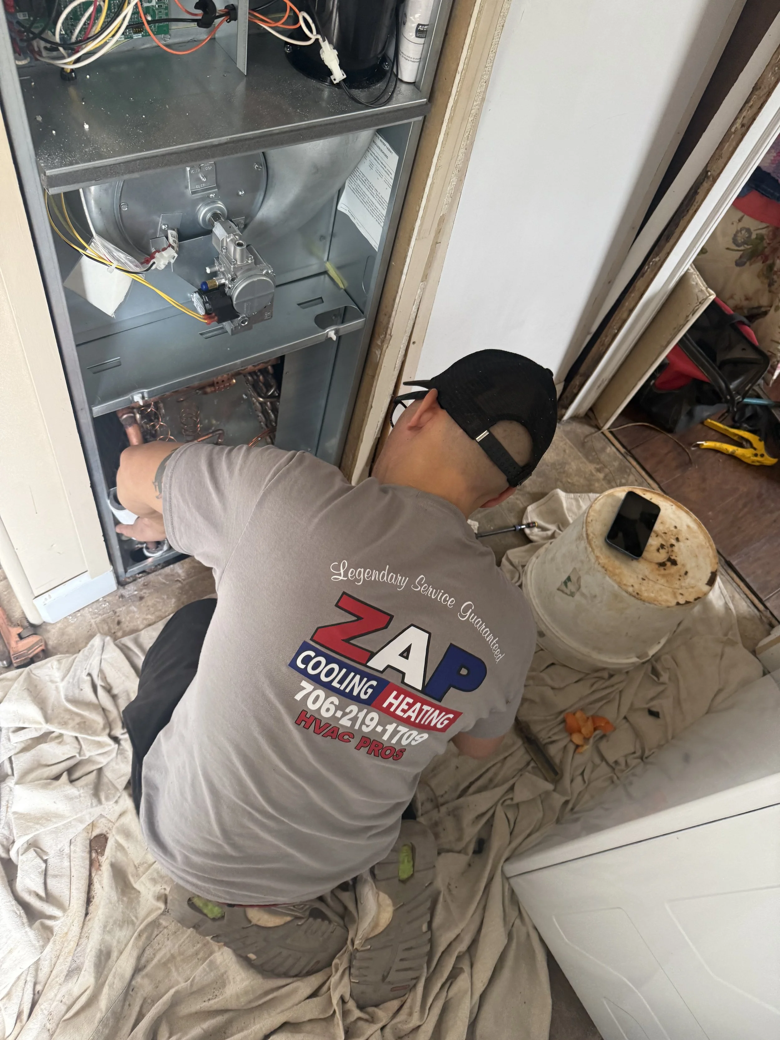 ZAP HVAC Technician Working on a New Furnace Unit