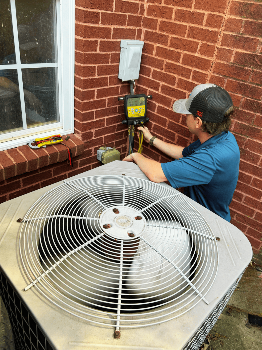 HVAC Technician checking AC unit