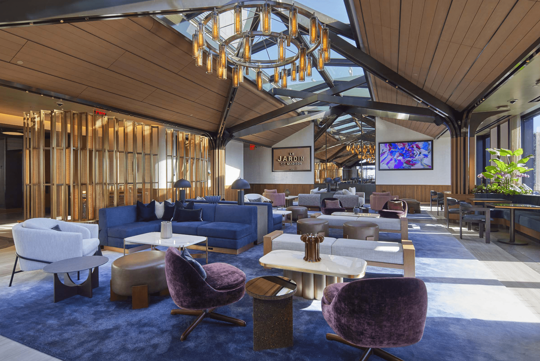 Inside of Le Jardin restaurant including a sophisticated interior design of gold and wood paneling