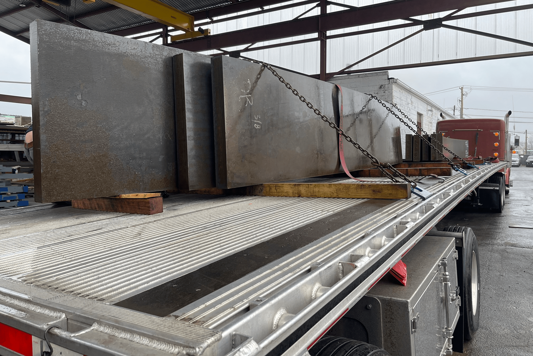 Iron slates chained to a truck