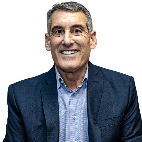 Portrait of a middle-aged man with short gray hair wearing a navy blazer over a light blue shirt, smiling against a black background.