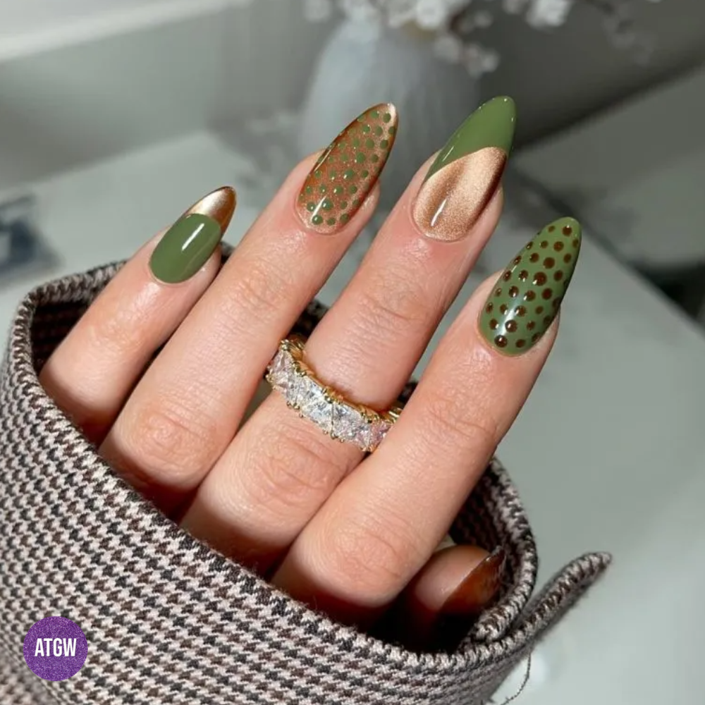 Fall nail design featuring metallic rose-gold swoops and olive green dot accents.