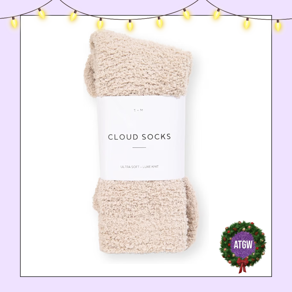 Folded pair of oatmeal beige T+M Ultra-Luxe Cloud Socks wrapped in a white paper label.