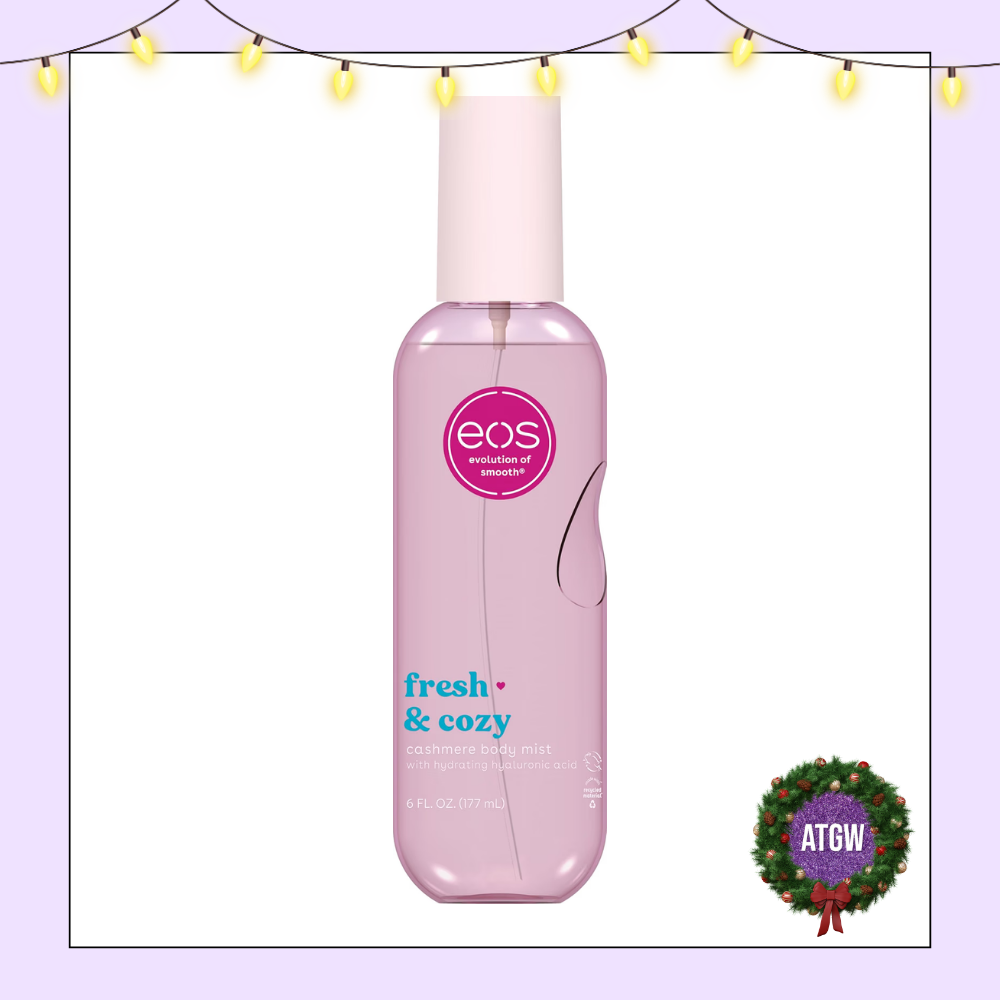 A translucent pink bottle of eos Fresh & Cozy Cashmere Body Mist topped with a pastel pink cap.