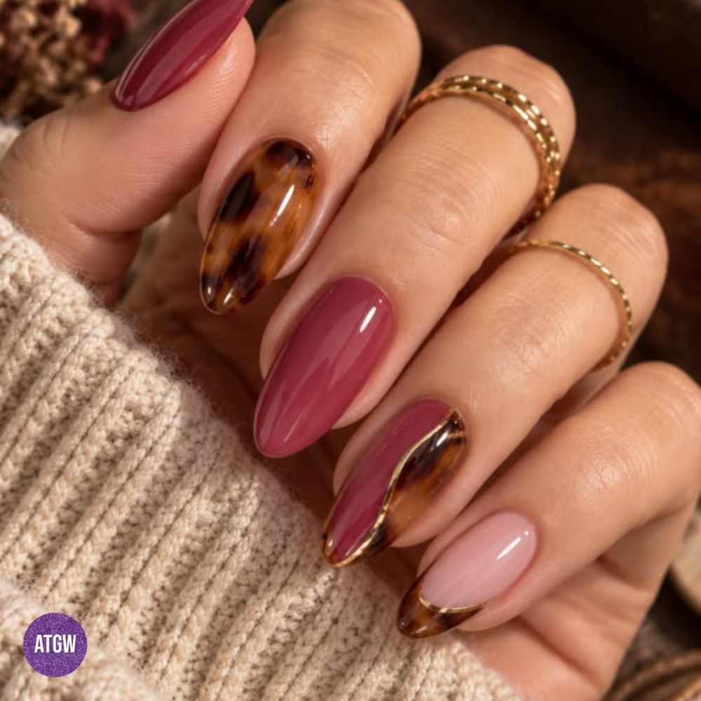 Nail design featuring polished mauve paired with gold-rimmed tortoiseshell.