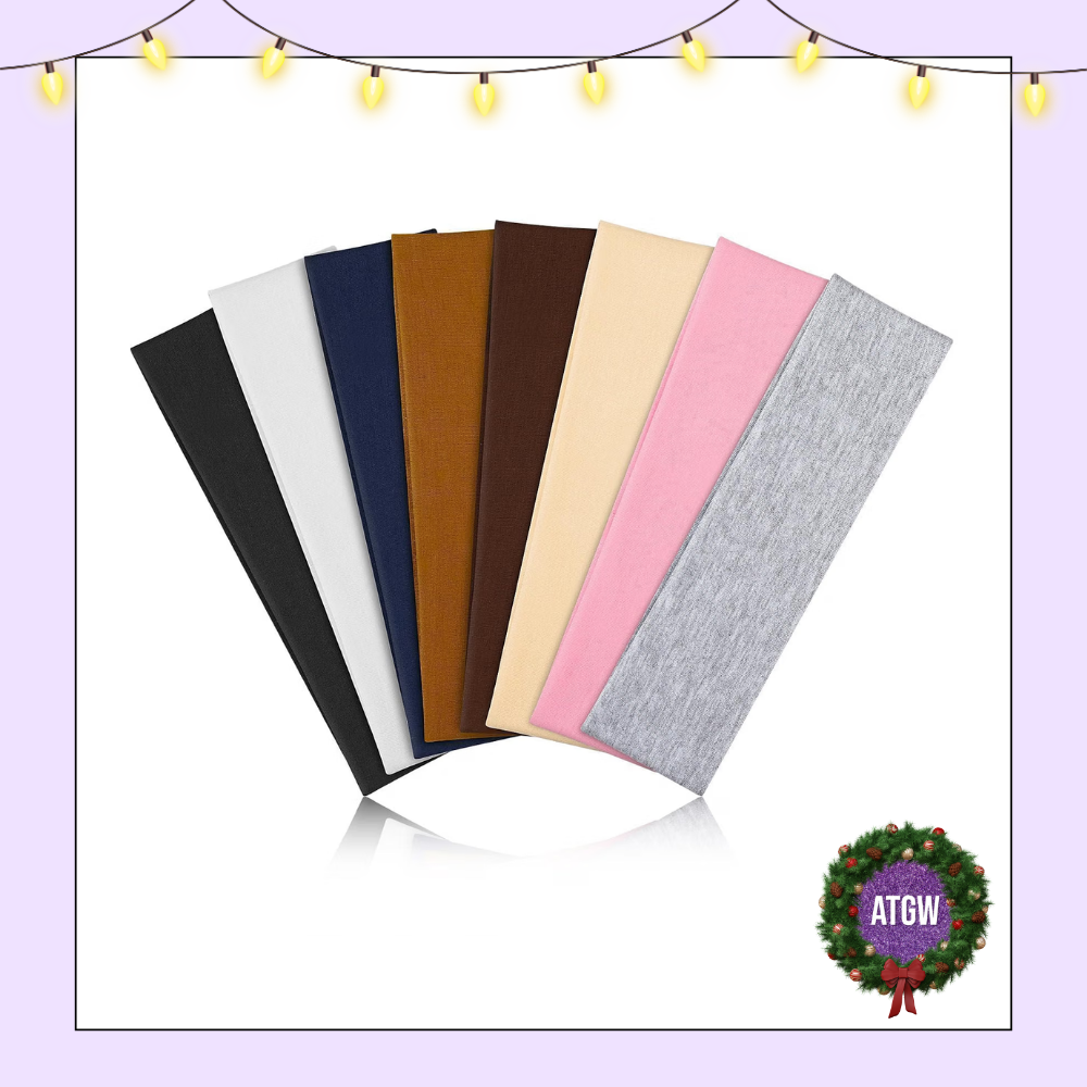 Eight wide cloth headbands fanned out in neutral tones including black, white, navy, brown, nude, pink, and heather grey.