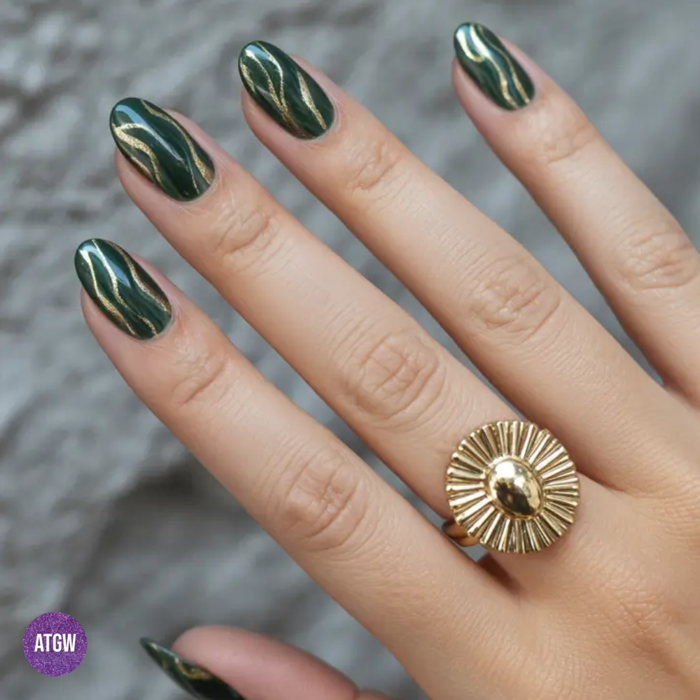 Deep forest green nail design paired with metallic gold accents, perfect for the fall season.