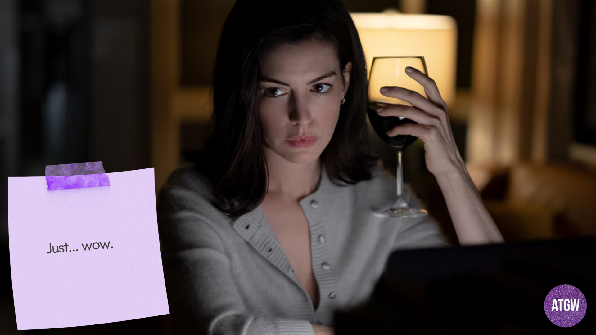Anne Hathaway as Verity Crawford with a glass of wine.