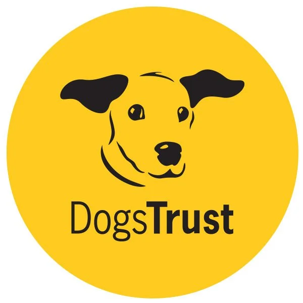 A yellow circle logo with a black line drawing of a dog's face and the words "Dog's Trust" underneath.