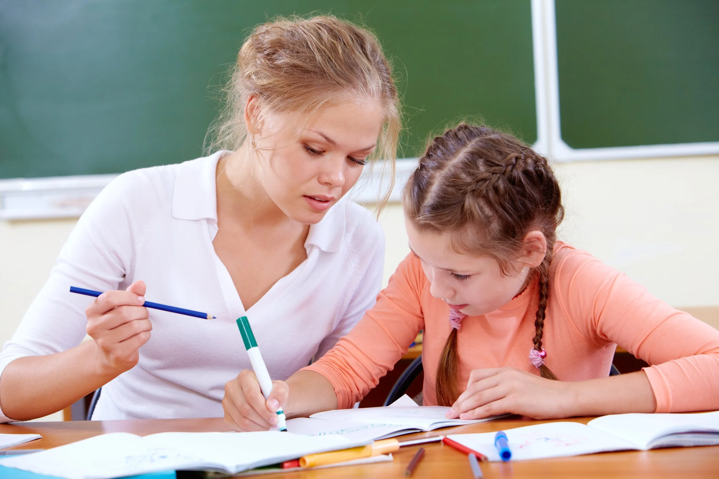 teaching assistant working with child