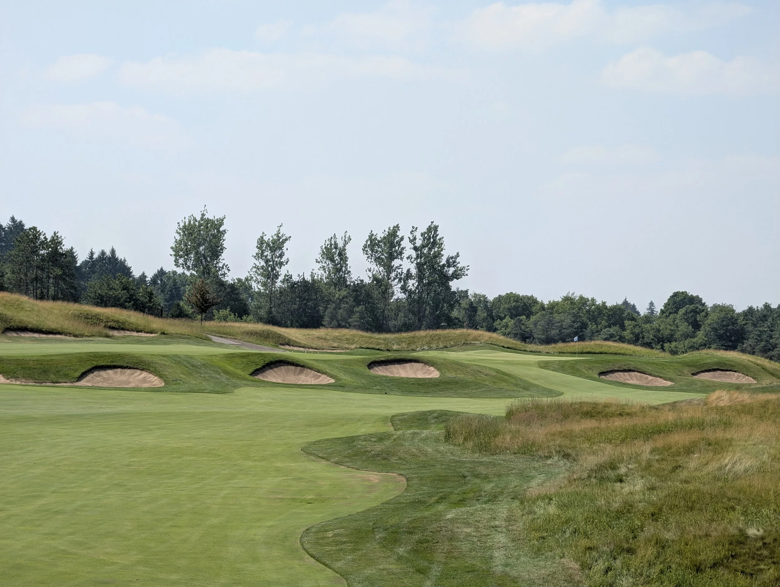 Lovely cross bunkers highlight the strategic and penal risks at the par 5 10th