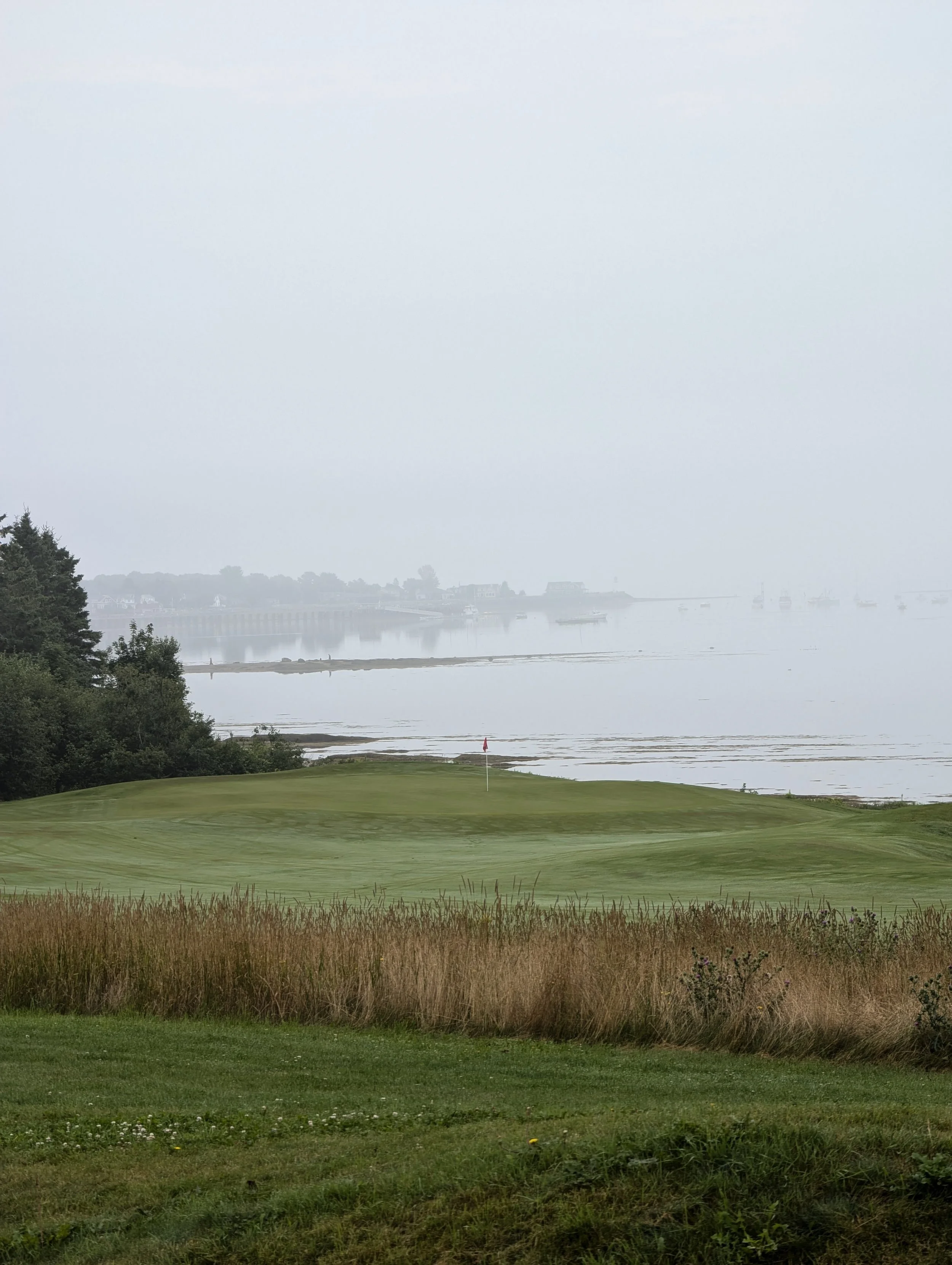 13th green sits along the edge of the bay