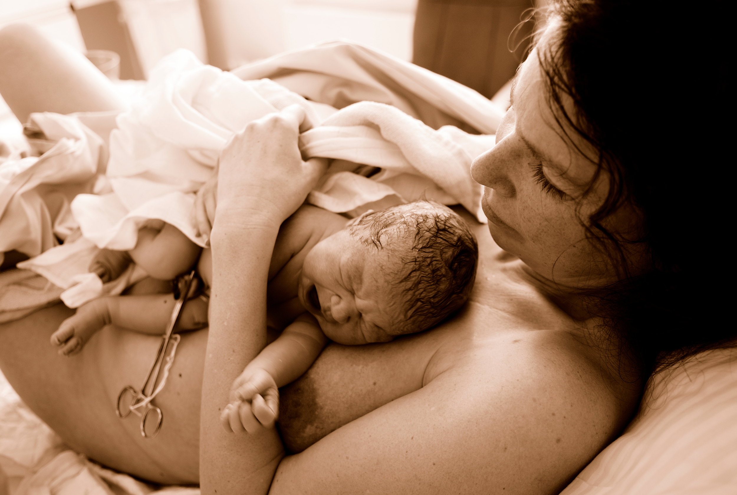 Mother and newborn at birth in skin to skin