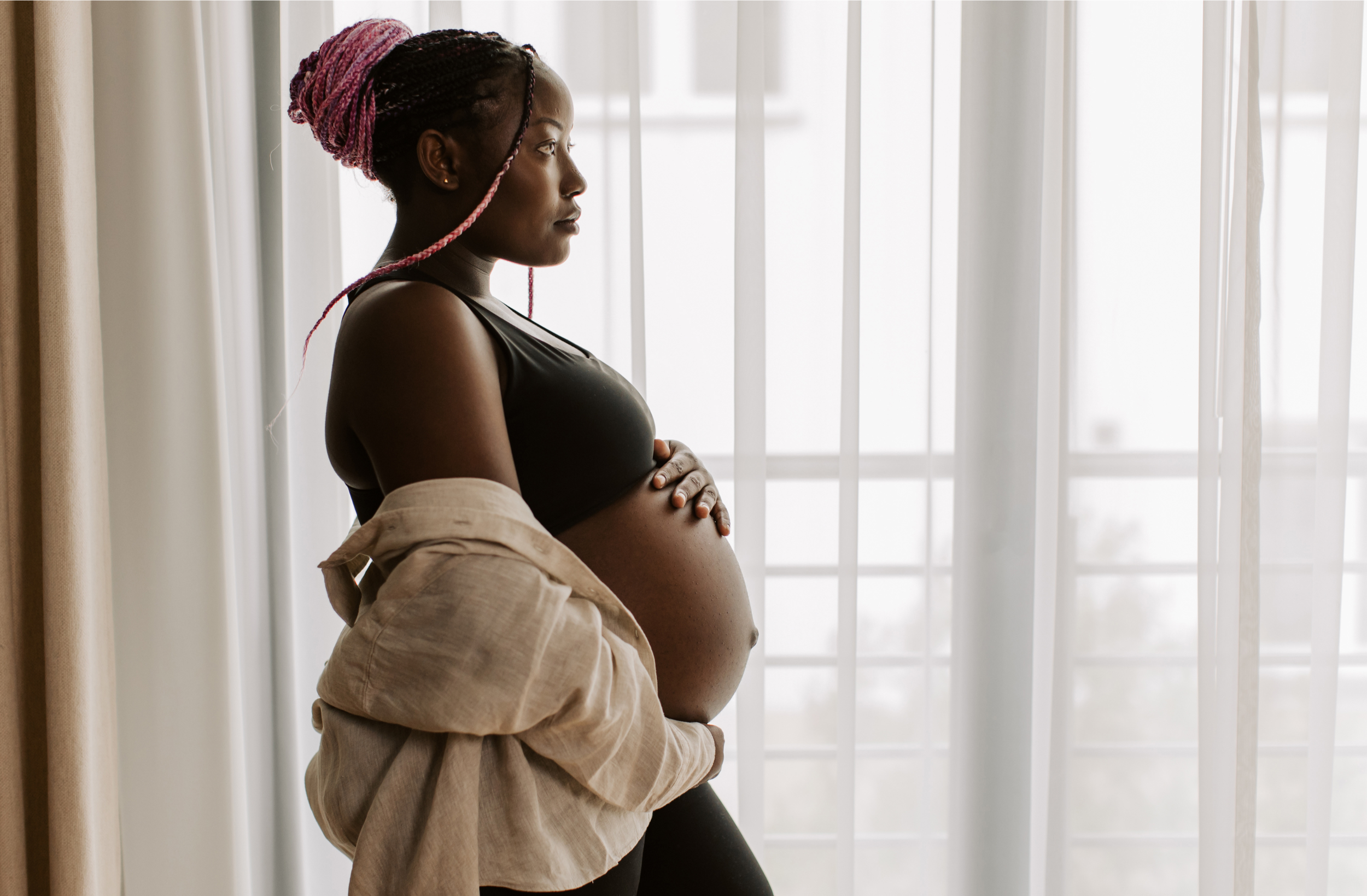 Pregnant woman holding her bump