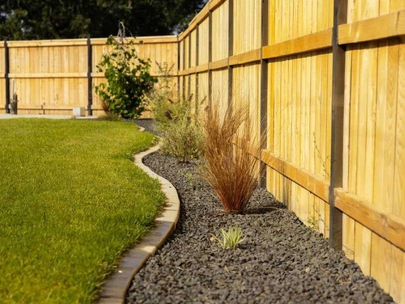 California home garden landscape with fence and ornamental grass