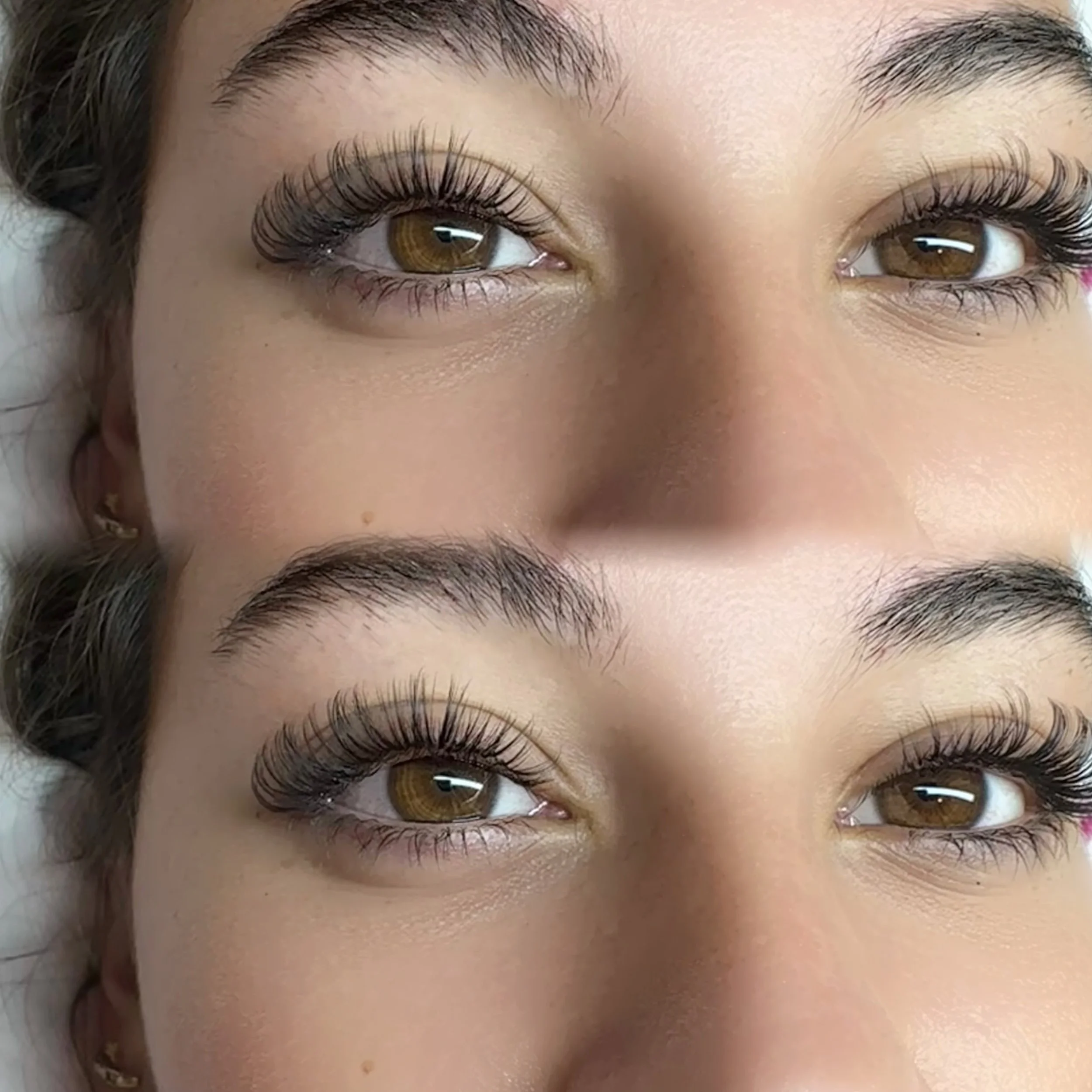 Close-up of a woman's eyes showing long, lifted eyelashes, brown irises, and well-groomed eyebrows.