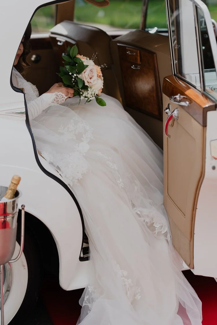 NJ Wedding Photography  of a bride stepping out of her car before her nj wedding ceremony