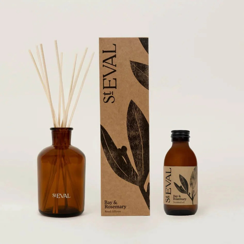 St. Eval Bay & Rosemary reed diffuser with glass bottle and natural reeds, displayed against a neutral background